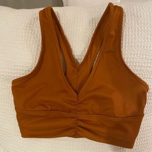 Burnt orange Alo sports bra